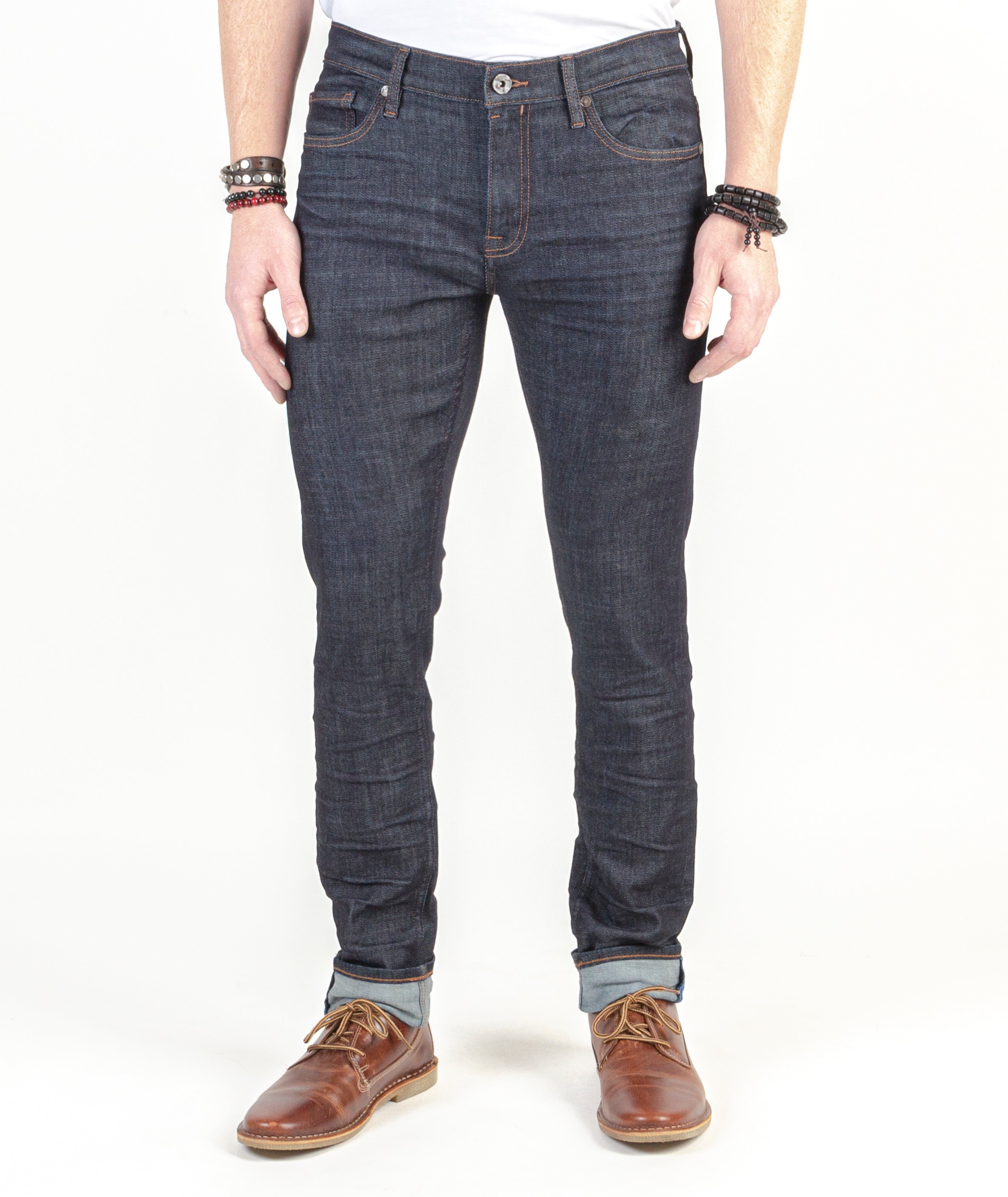 Blade Raw Slim Tapered Fit Jeans worn by model, emphasizing the authentic design, perfect fit, and lasting quality.